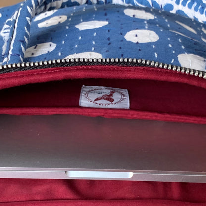 "Indigo laptop bag with Dabu handblock print, featuring intricate patterns and sturdy handles for a stylish and functional design."