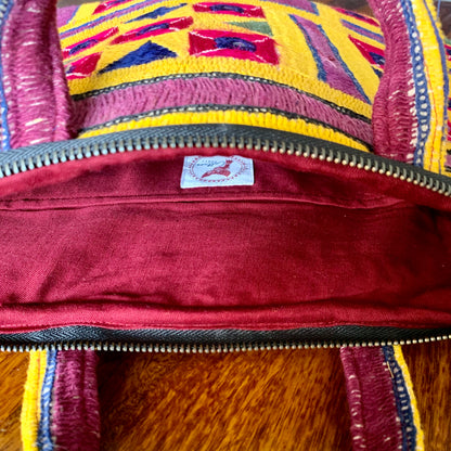 "ABHLA - Vintage Kutch Embroidery Laptop Bag with intricate, vibrant traditional designs, showcasing handcrafted details and cultural artistry."
